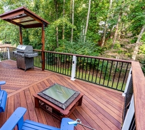 Cumaru 1x6 hardwood deck with hidden clip fasteners and black metal railing