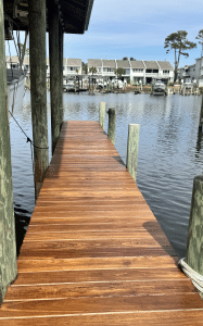 Freshly oiled purpleheart 1x6 boat dock walkway with rich reddish-brown tones in Panama City Beach, Florida