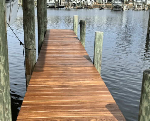 Freshly oiled purpleheart 1x6 boat dock walkway with rich reddish-brown tones in Panama City Beach, Florida