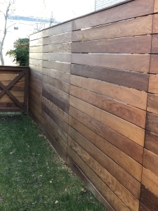 Ipe hardwood horizontal privacy fence installed using materials from Brazilian Wood Depot.