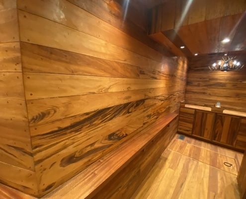 Tigerwood 5-inch T&G accent wall paneling inside a Sandy Springs GA gun room.