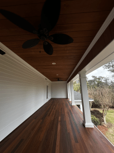 Ipe tongue-and-groove porch with rich brown color variation and smooth, refined grain.