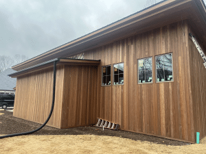 Brown Balau Rainscreen Siding – Modern Vertical Wood Cladding Brown Balau rainscreen siding installed vertically on a modern home exterior with natural wood grain and concealed fastener system.