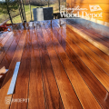 Oiled Cumaru 1×6 solid decking boards reflecting sunlight, revealing enhanced grain, warm coloration, and premium hardwood decking beauty.