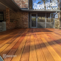 Fresh Cumaru 1×6 solid decking installed on a residential patio, showing warm color variation and premium hardwood decking quality.
