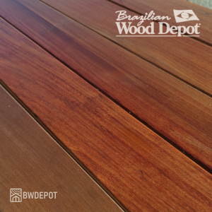 Freshly oiled Ipe 5/4×4 decking boards with warm reddish-brown grain ideal for heavy-duty ipe hardwood decking.