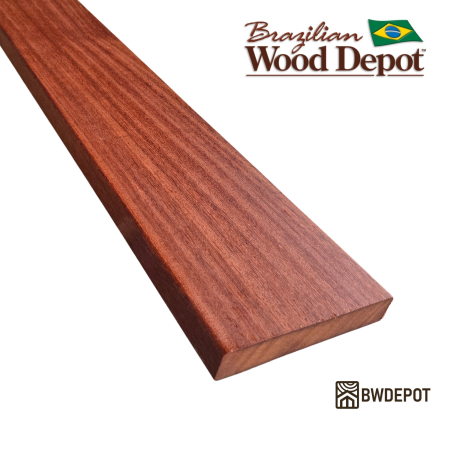 Close-up of a Cumaru 5/4x6 solid decking board showing dense grain and rich red-brown color.