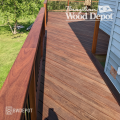 Cumaru deck walkway and railing area showing smooth grain texture and warm brown tones.