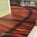 Curved Cumaru tongue and groove porch with vibrant red-brown tones and seamless hardwood layout.