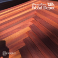 Herringbone-pattern Cumaru tongue and groove porch flooring with deep red and golden tones.