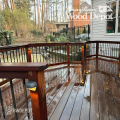 Wet Ipe deck with modern railing using Ipe 2×4 components, showing rich grain and durability ideal for premium Ipe decking projects.