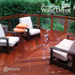 Outdoor deck built with Cumaru grooved one side decking featuring rich tones and outdoor seating.