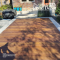 Installed Ipe 1x6 deck featuring bottom kerf boards arranged in a decorative border and field layout with warm natural wood tones.