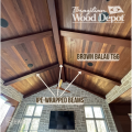 Brown Balau tongue and groove ceiling boards installed with Ipe-wrapped beams in a covered outdoor space