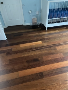 Unfinished 5 inch tongue and groove Ipe flooring installed in a residential bedroom