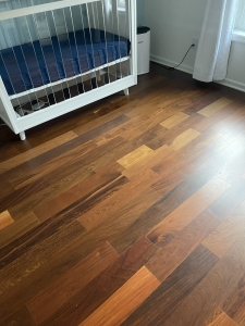5 inch tongue and groove Ipe flooring installed near windows in a bedroom
