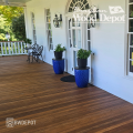 Brown Balau 1x4 tongue and groove hardwood decking installed on a traditional covered front porch by Brazilian Wood Depot