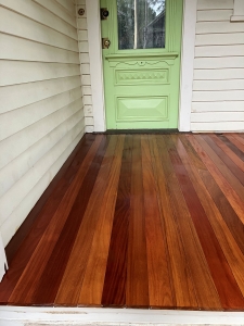 Cumaru 1x4 T&G decking installed on finished porch with straight board layout