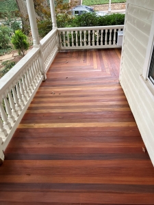 Finished Cumaru decking porch with railing using Cumaru tongue and groove boards