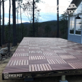 Elevated platform deck finished with Red Balau Deck Tiles in outdoor setting