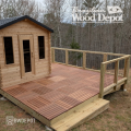 Residential deck built with Red Balau Deck Tiles surrounding small structure
