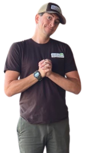 Sam H., Brazilian Wood Depot Sales Director, wearing company hat and branded t-shirt with hands clasped