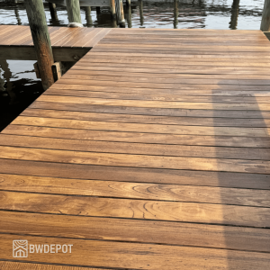 Purpleheart hardwood decking installed on a waterfront dock with visible grain patterns and uniform board spacing.