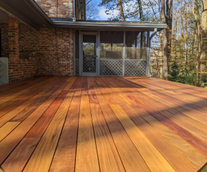 Cumaru Gold decking boards installed on a residential deck, showing lighter golden-brown tones and natural color variation.