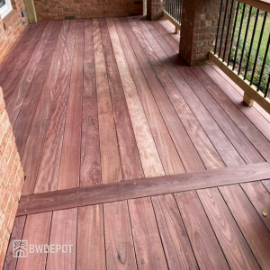 Purpleheart decking installed on a covered porch with visible color variation and natural wood grain.