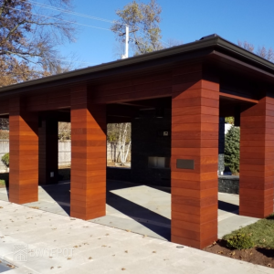 Outdoor pavilion wrapped in Massaranduba hardwood siding panels with clean horizontal lines.