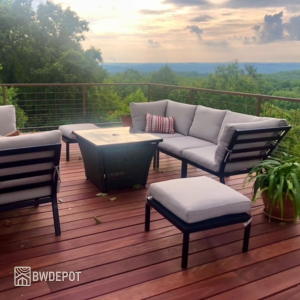Outdoor seating set placed on a Purpleheart hardwood deck overlooking a scenic wooded landscape.