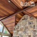 Garapa tongue and groove porch ceiling and garapa cladding against stone wall