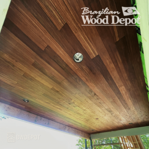 Brown Balau Hardwood Ceiling with Recessed Lighting – Exterior Soffit Application Brown Balau tongue and groove ceiling with recessed lights installed under covered patio roof.