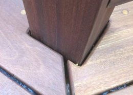 Close-up of Ipe decking boards with eased rounded ends and clean spacing around a deck post detail on BWDepot.com